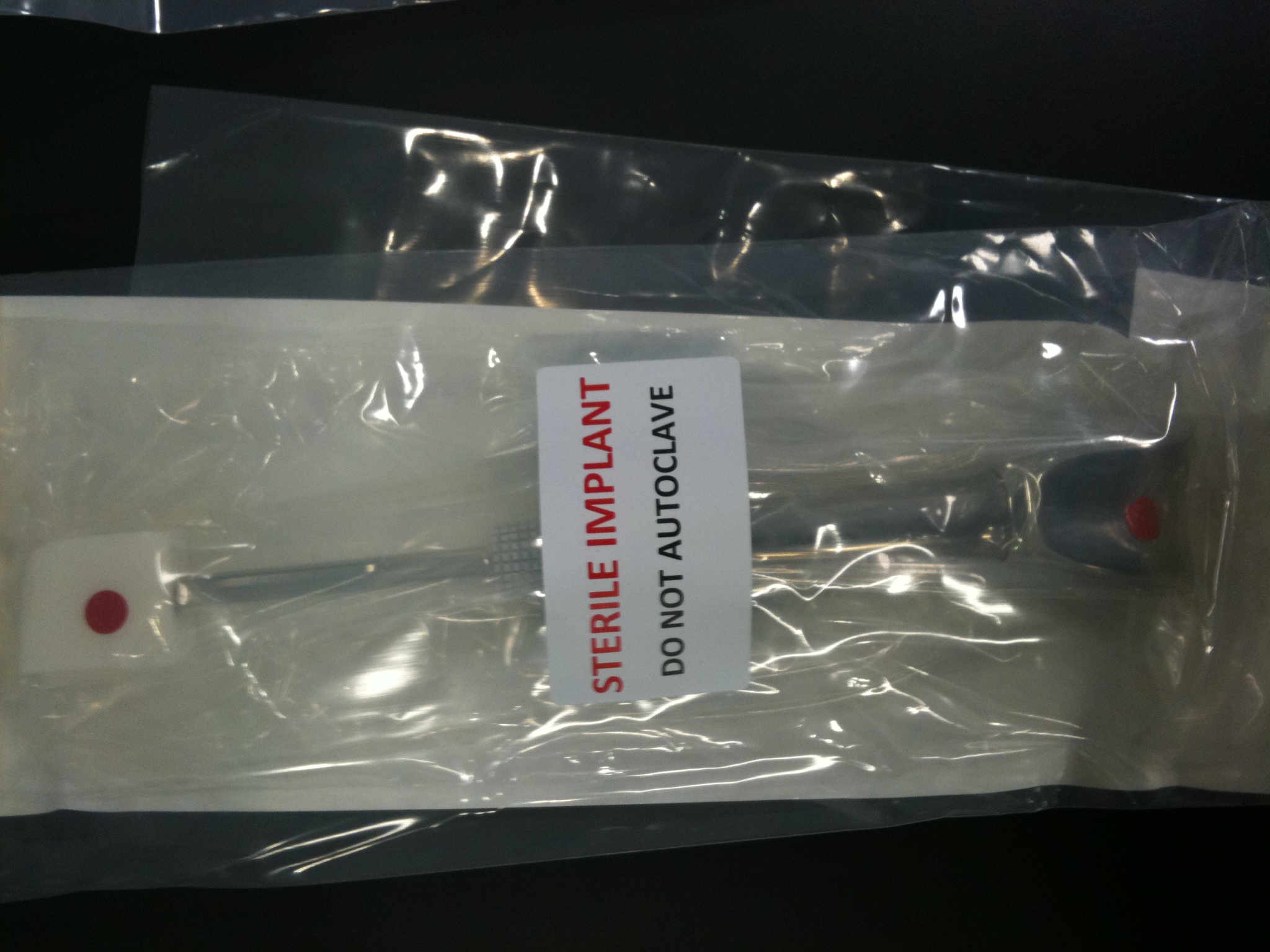 Packed femoral component, sterile